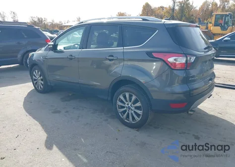 2017 Ford Escape Titanium z USA, uszkodzony, nr VIN 1FMCU0JD0HUC44640